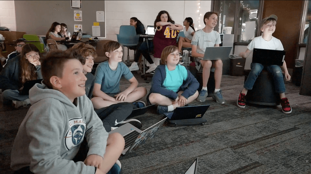 Students engaged with devices during a Curipod lesson at Meads Mill Middle School